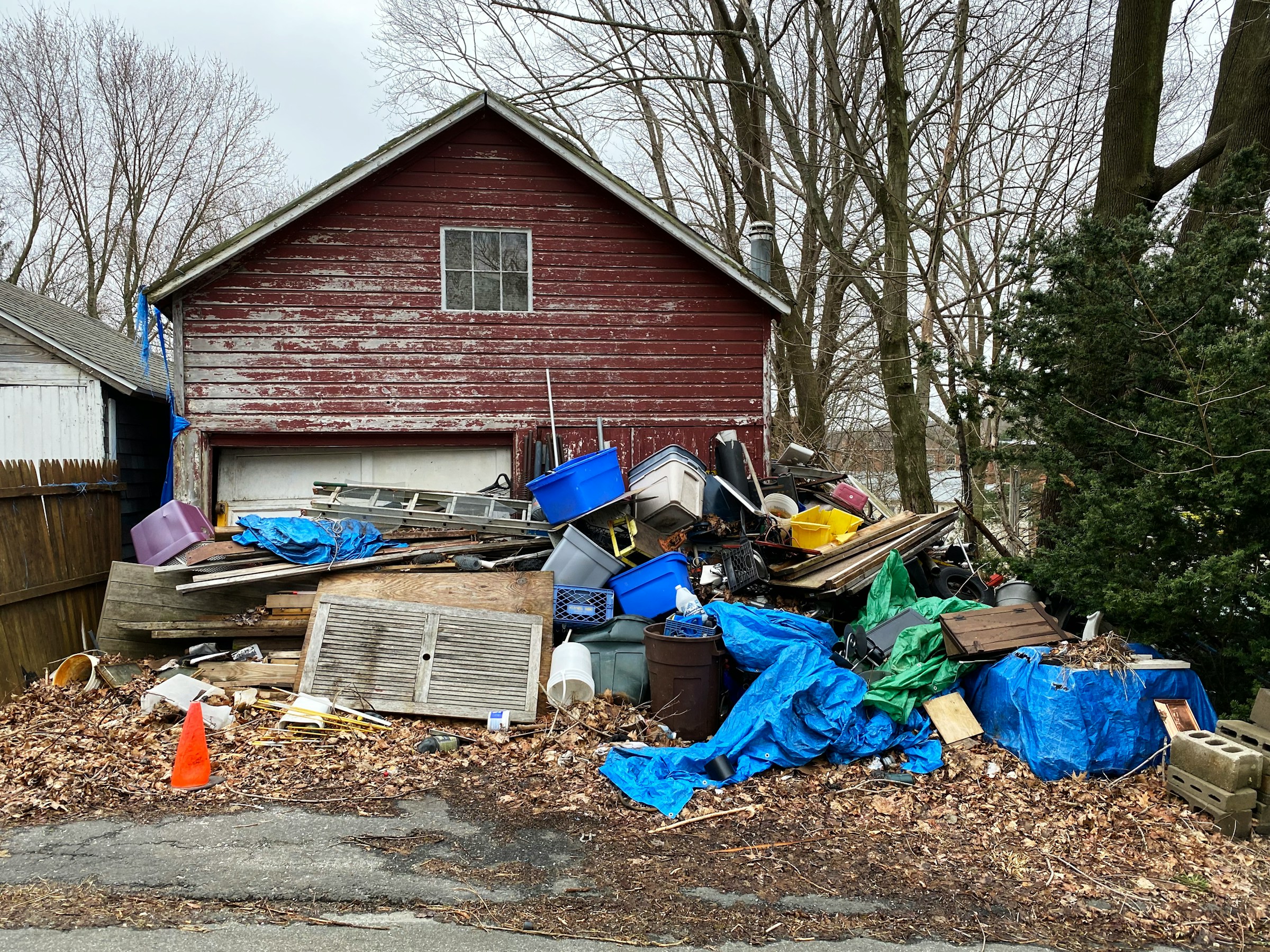JunkStart featured image -- trash in front of a house